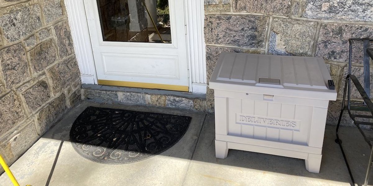a photo of Yale Smart Delivery Box on a porch