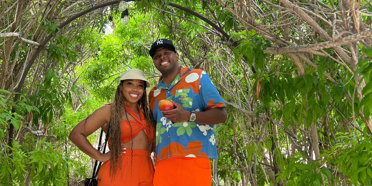 Serial-entrepreneur-couple-James-Deanna-Robinson-smiling-in-the-jungle-on-vacation