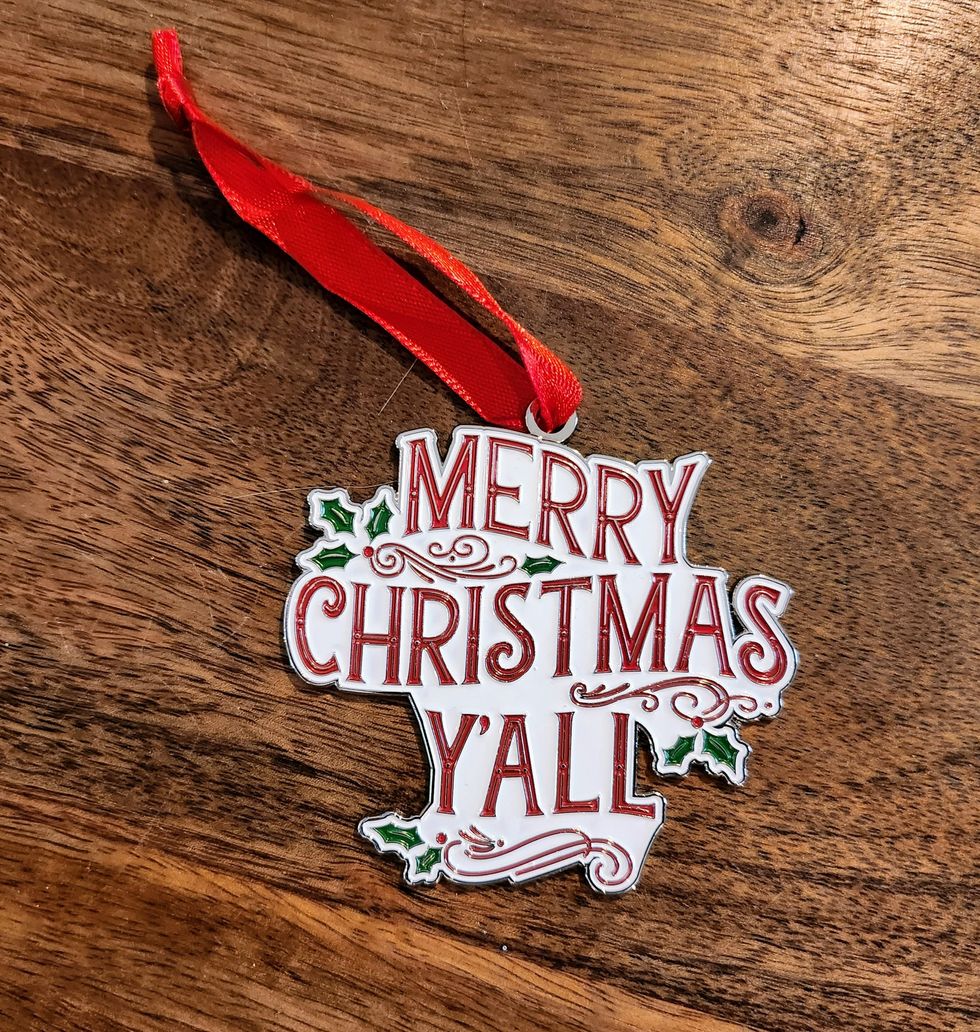 An ornament with a white background that says, 