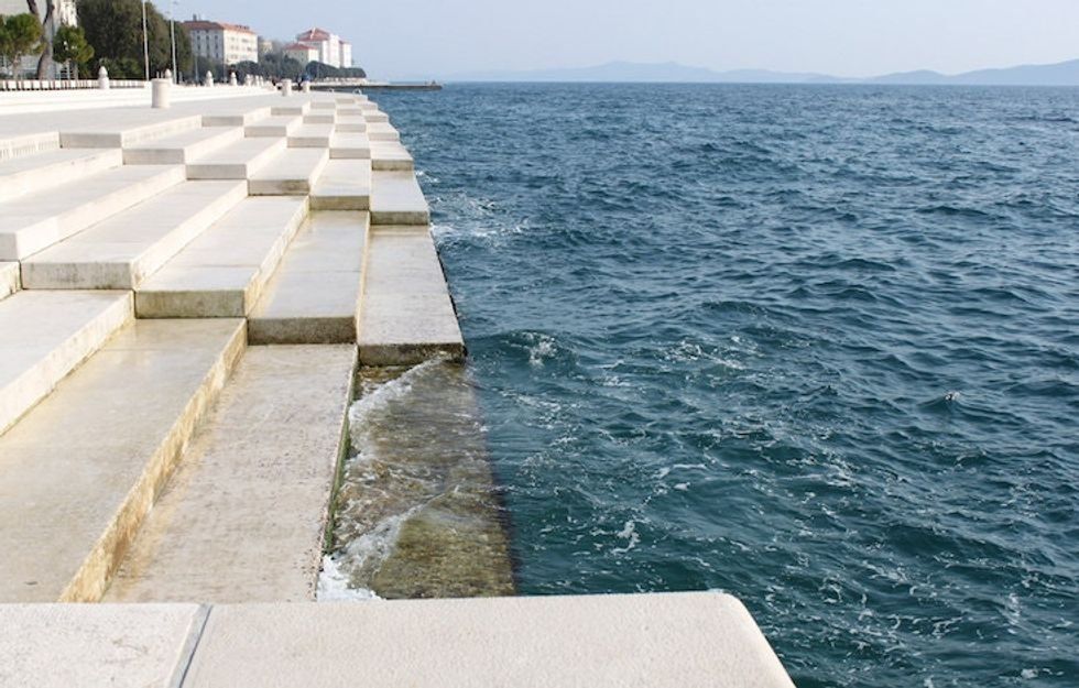 close up of waves hitting the sea organ