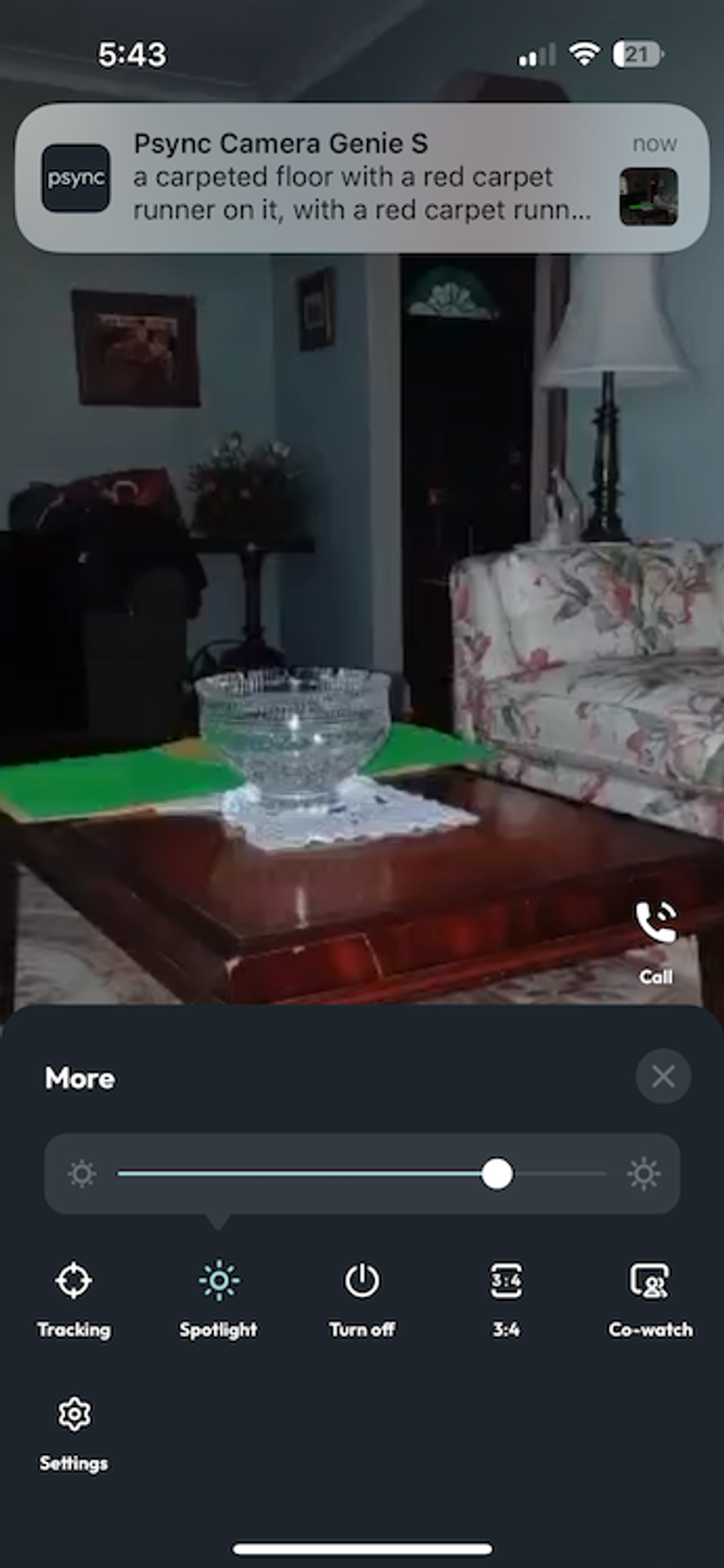 A screenshot from psync app showing live feed with controls and an alert