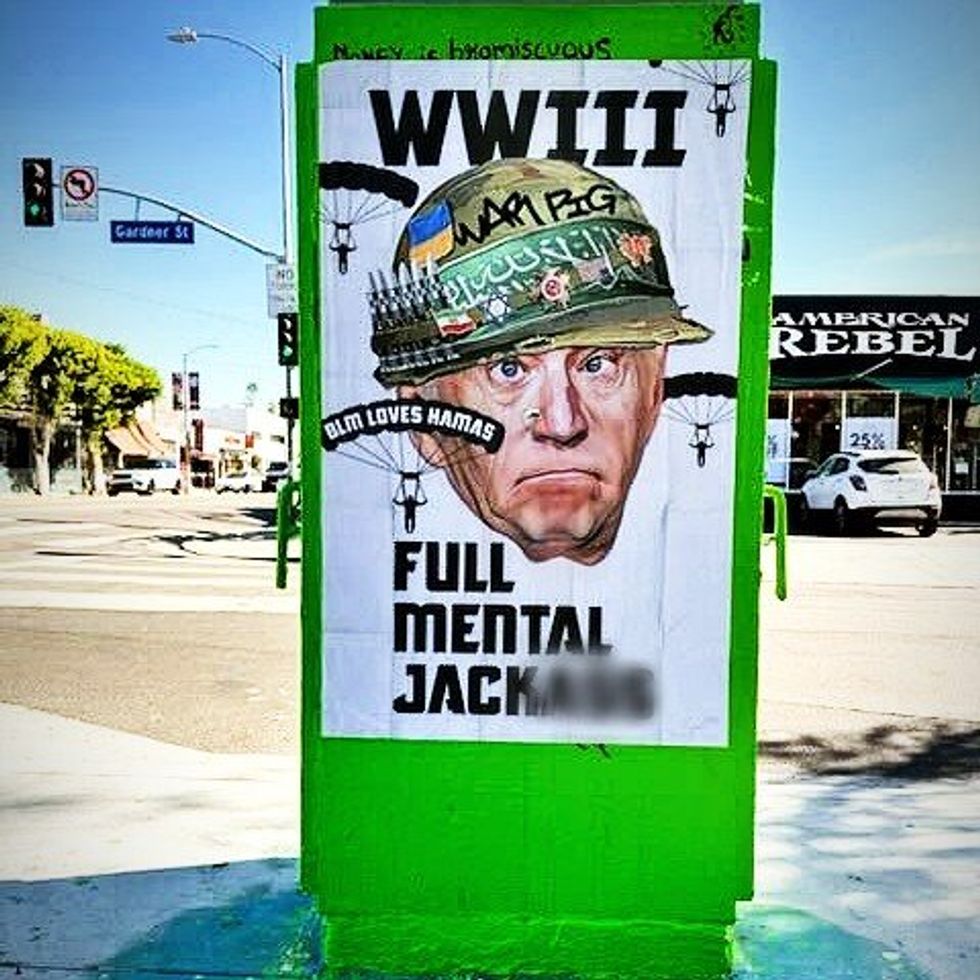Sabo displays his poster, "Full Metal Jacka**," which is inspired from the movie poster of hte Vietnam War-era film, "Full Metal Jacket."