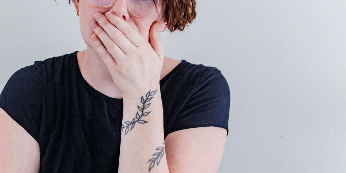Shocked woman covering her mouth with her hand