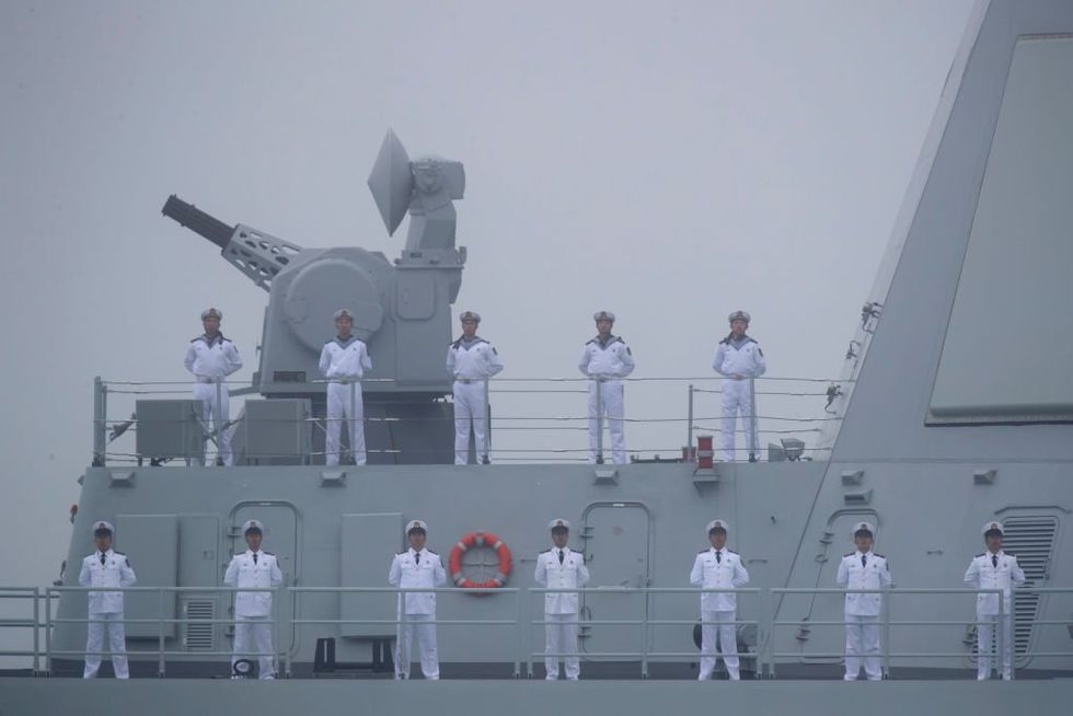 Chinese soldiers stand at attention during a Navy celebration for the People's Liberation Army.