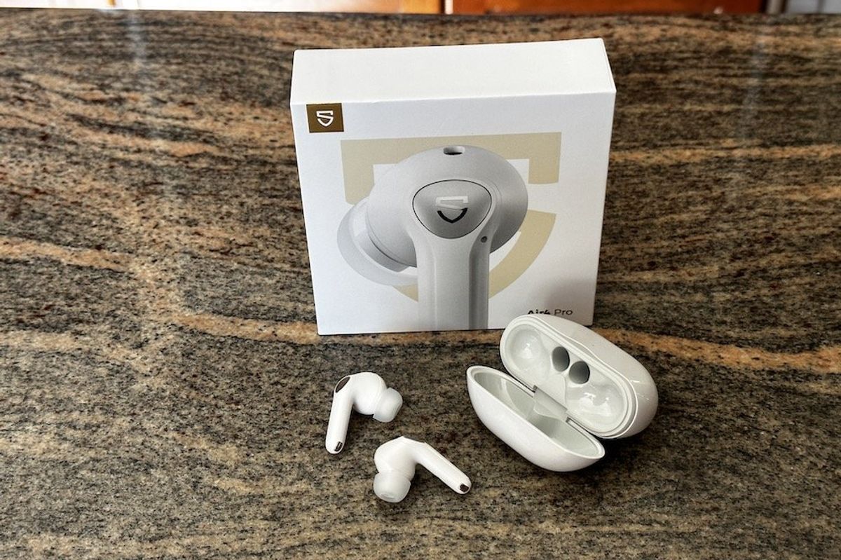 A photo of SoundPEATS Air4 Pro Wireless Earbuds outside their case
