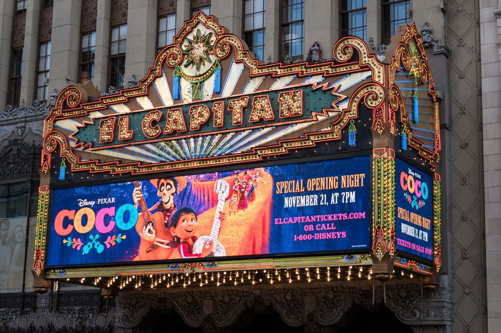 marquee at a movie theatre with a promotional image of the movie Coco