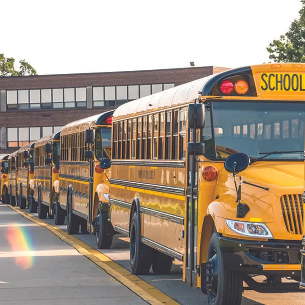 School buses lined up in a safety zone