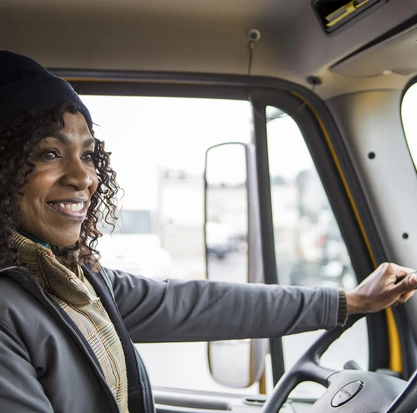 A happy truck driver behind the wheel