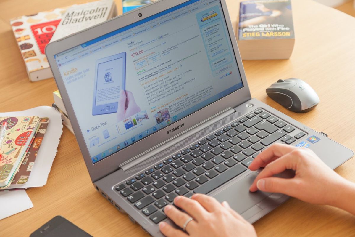 a photo of a laptop showing the amazon cart page
