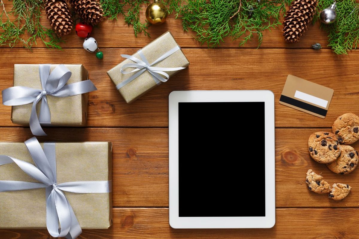 a tablet surrounded by gifts