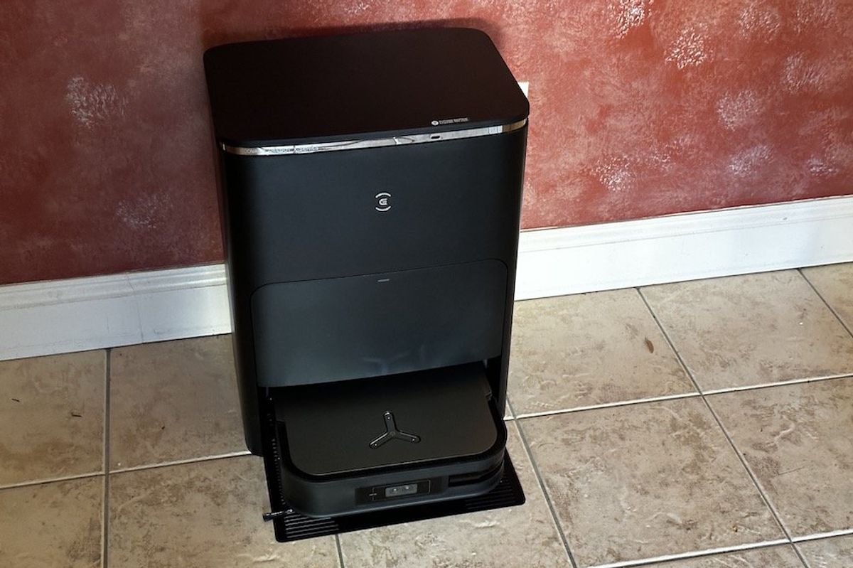 a product shot of Ecovacs DEEBOT X2 OMNI Robot Vacuum & Mop on a floor in a kitchen