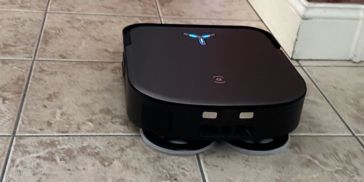 a photo of Ecovacs DEEBOT X2 OMNI Robot Vacuum & Mop mopping the floor