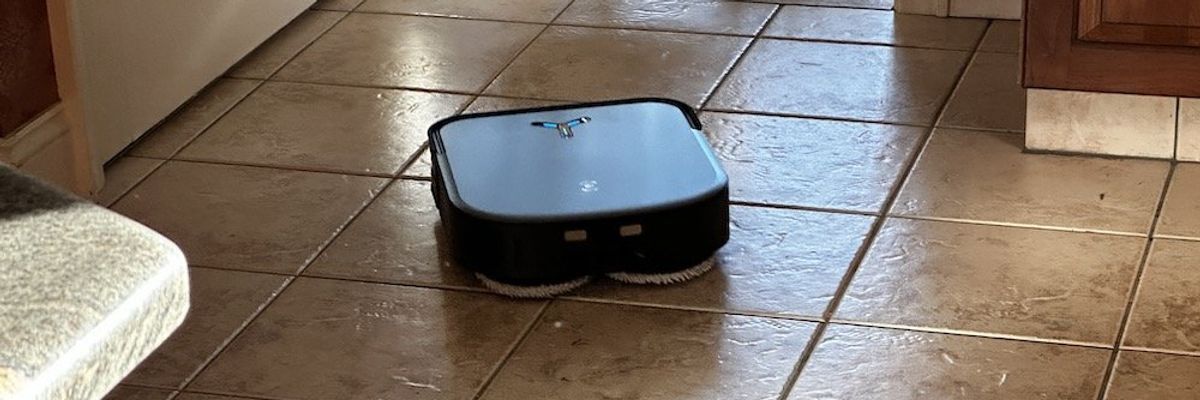 a photo of Deebot X2 Omni mopping the floor