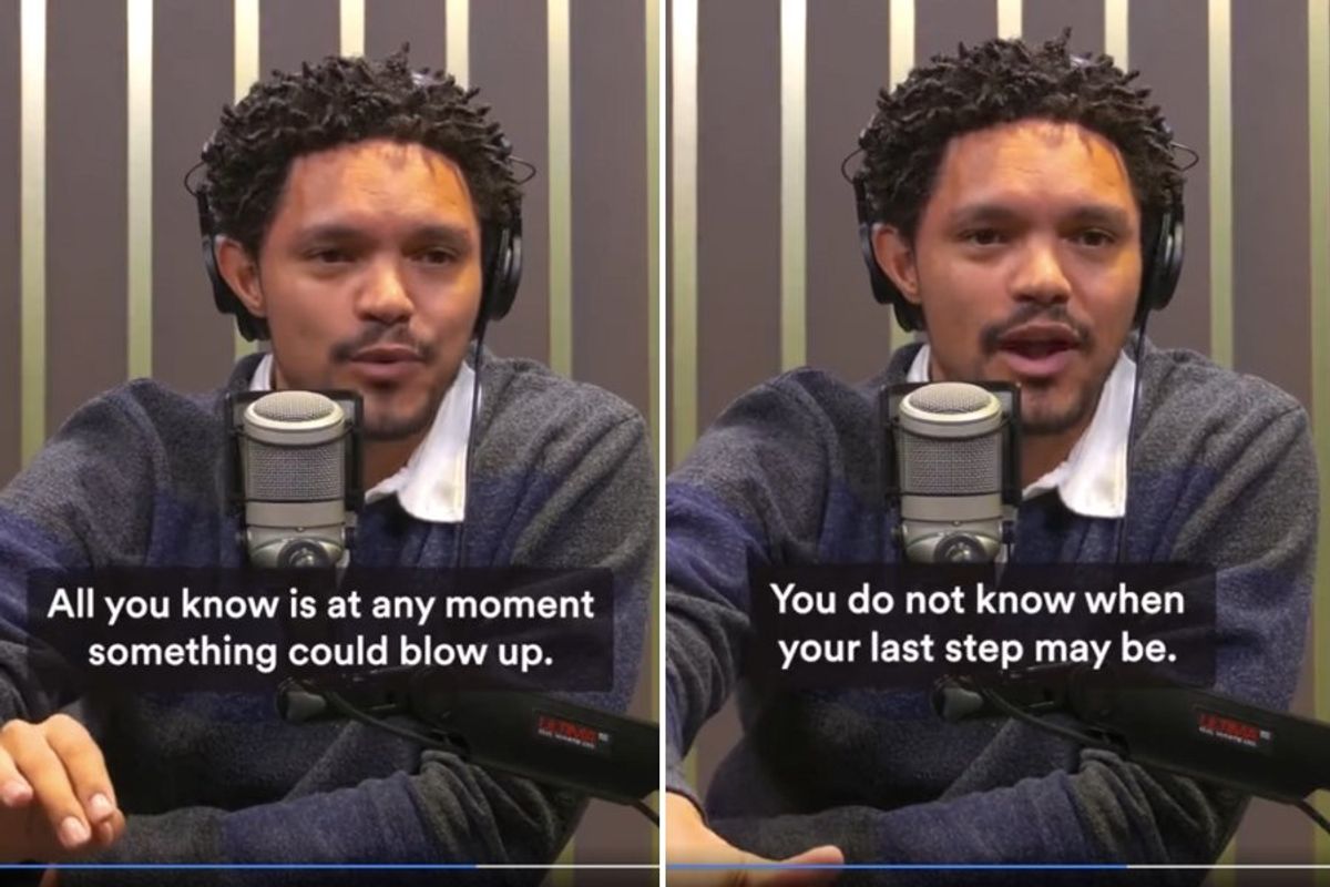 Trevor Noah speaking into a microphone