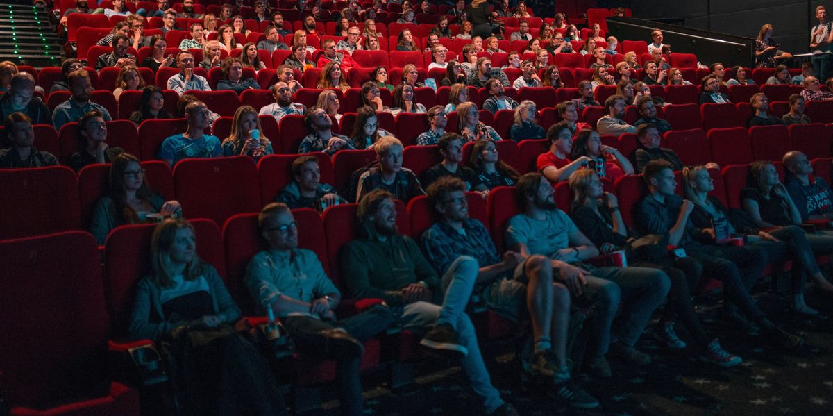 An audience watching a movie in a movie theatre