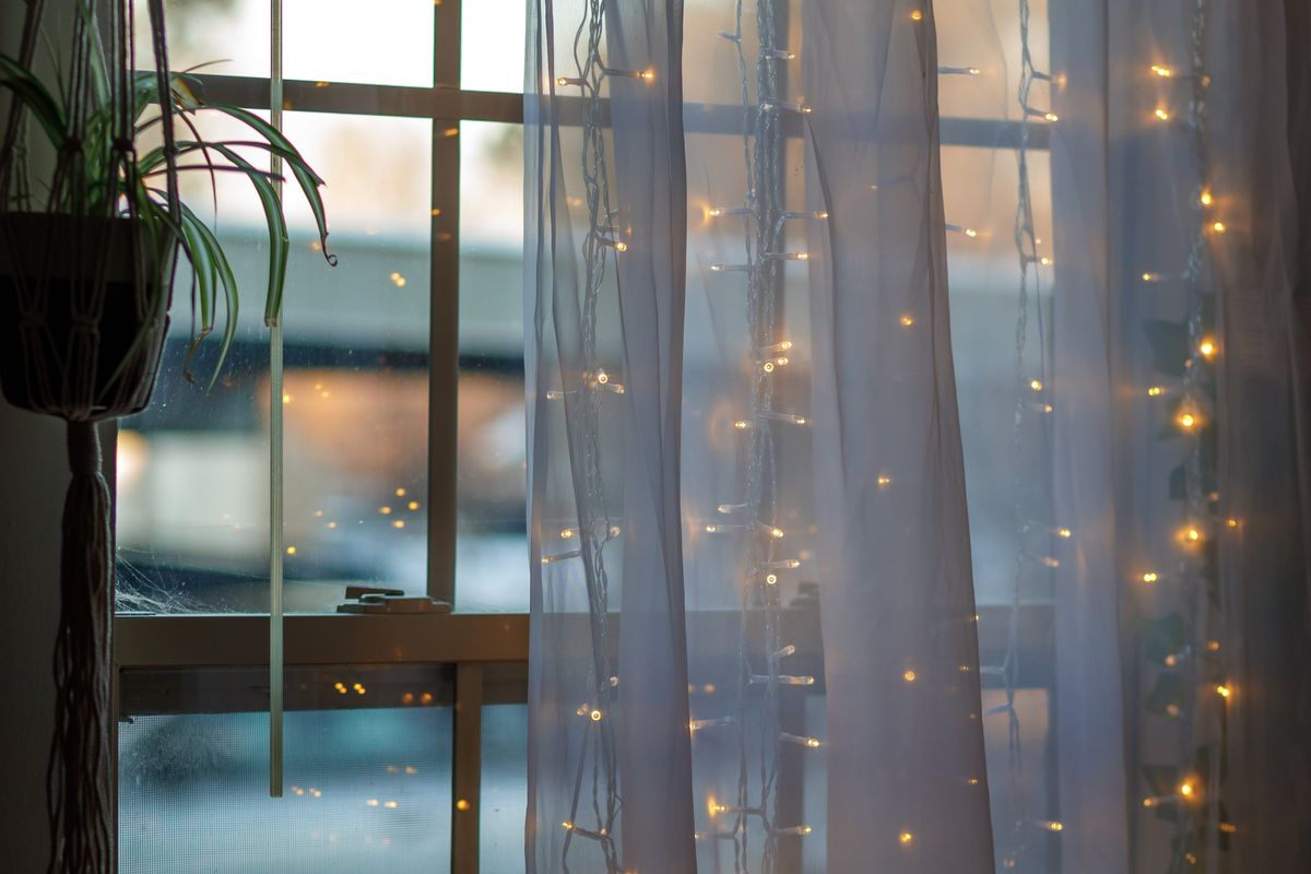 string lights in front of a window