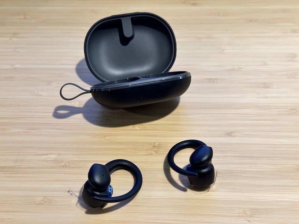a photo or SoundPEATS Wings2 wireless case and earbuds on a desk