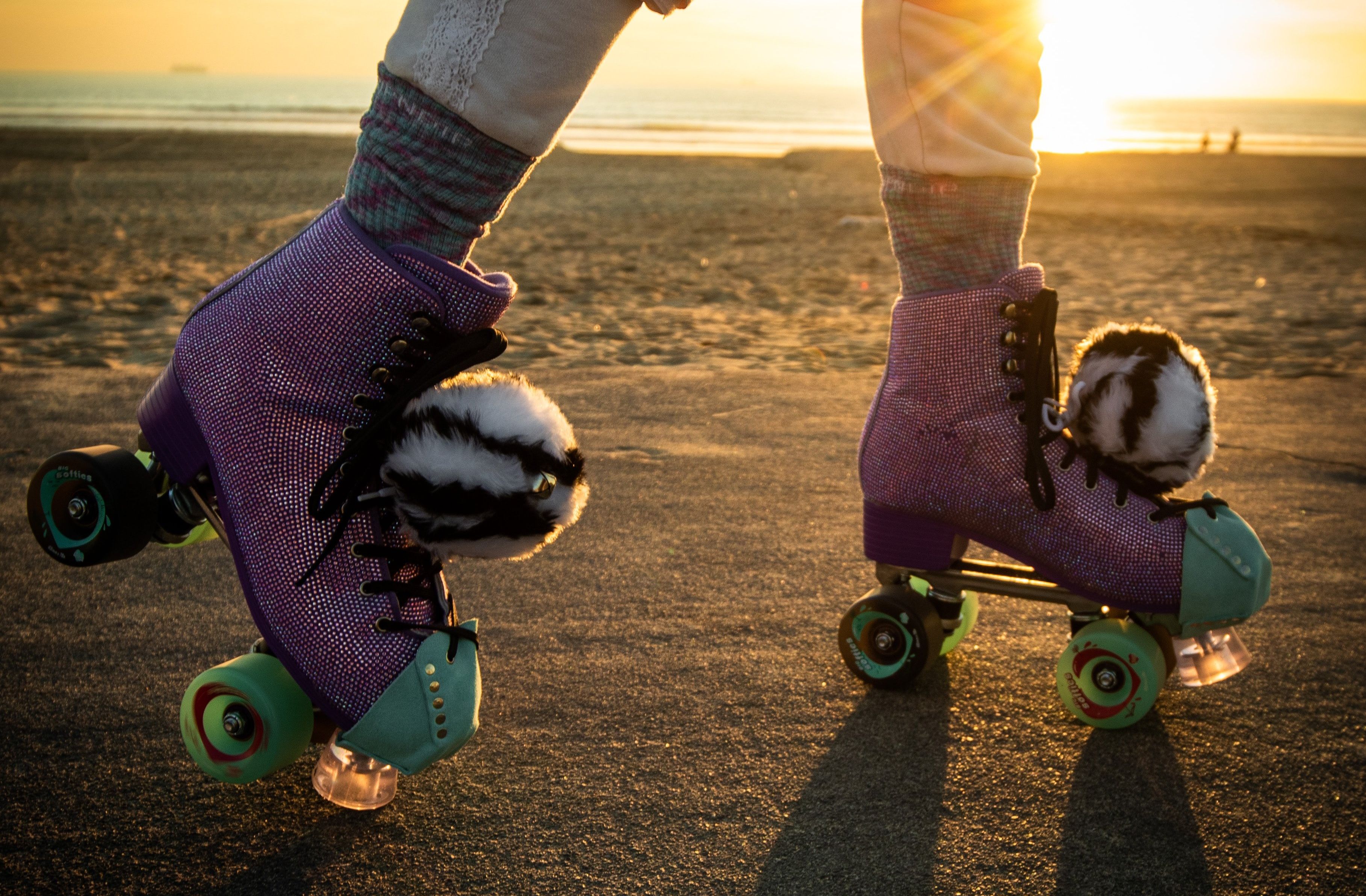 someone skating outside in pink roller skates