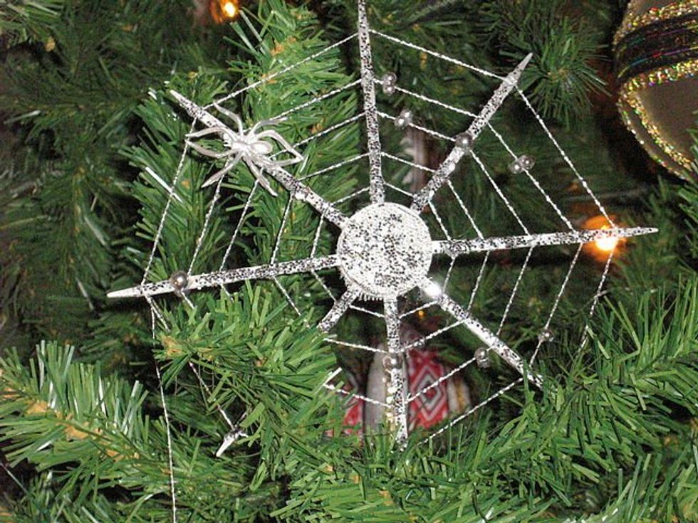 spider and spider web ornament in tree