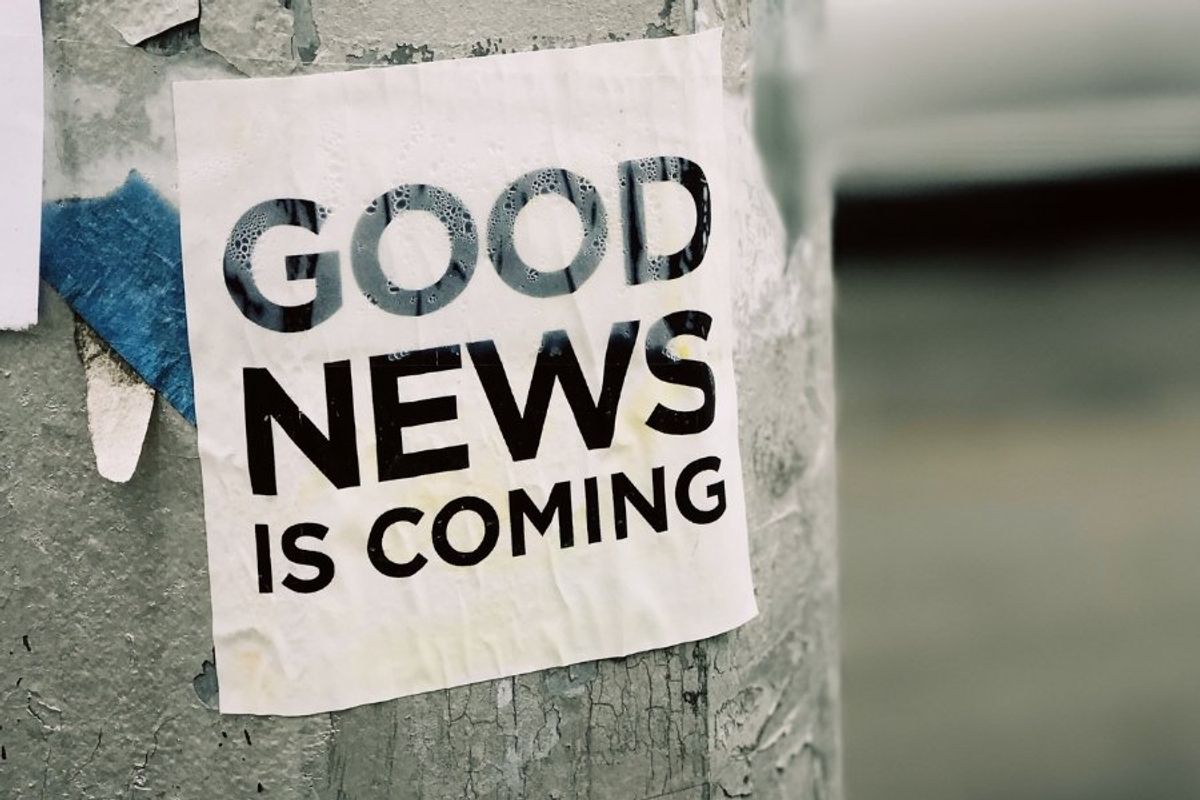 sign that says "good news is coming"