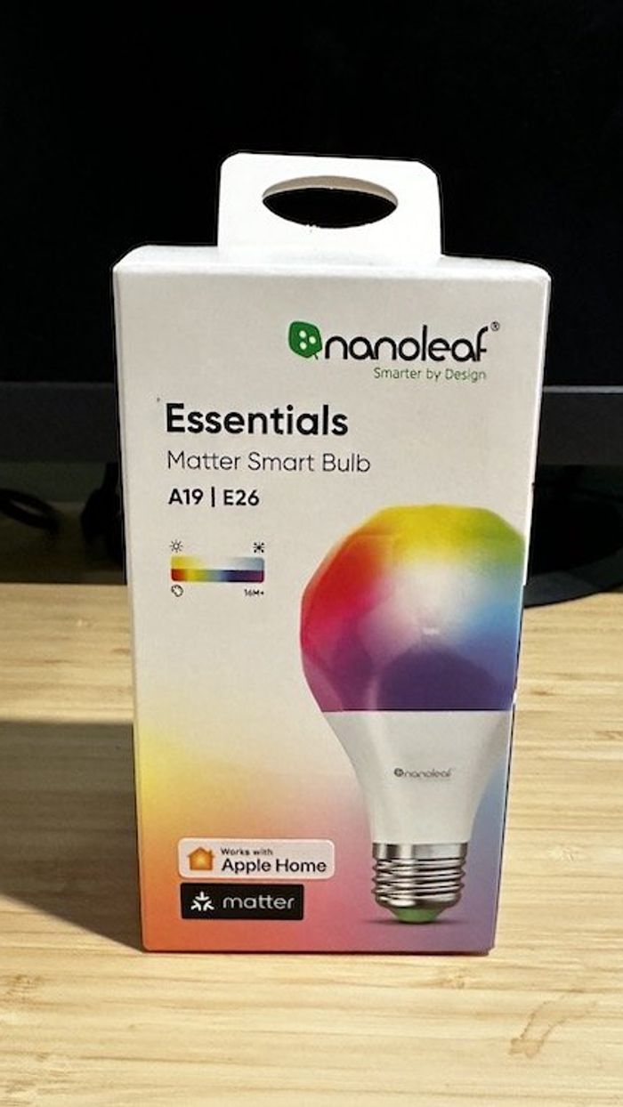a product shot of Nanoleaf Essentials A19 Smart LED Bulb