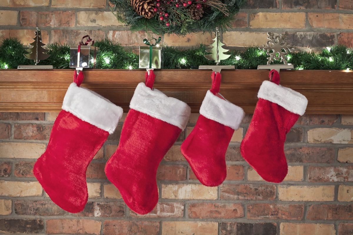 a photo of stocking hanging from the mantle at Christmas time.