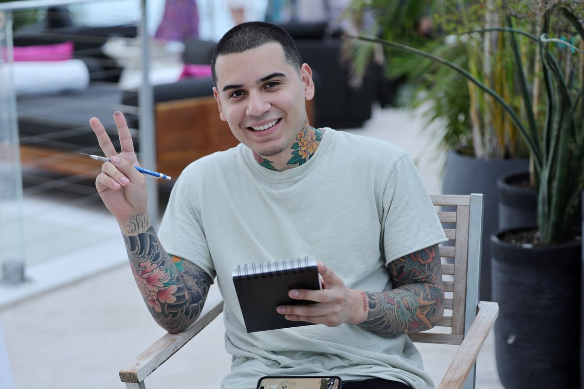 Devon Rodriguez holding a sketchpad