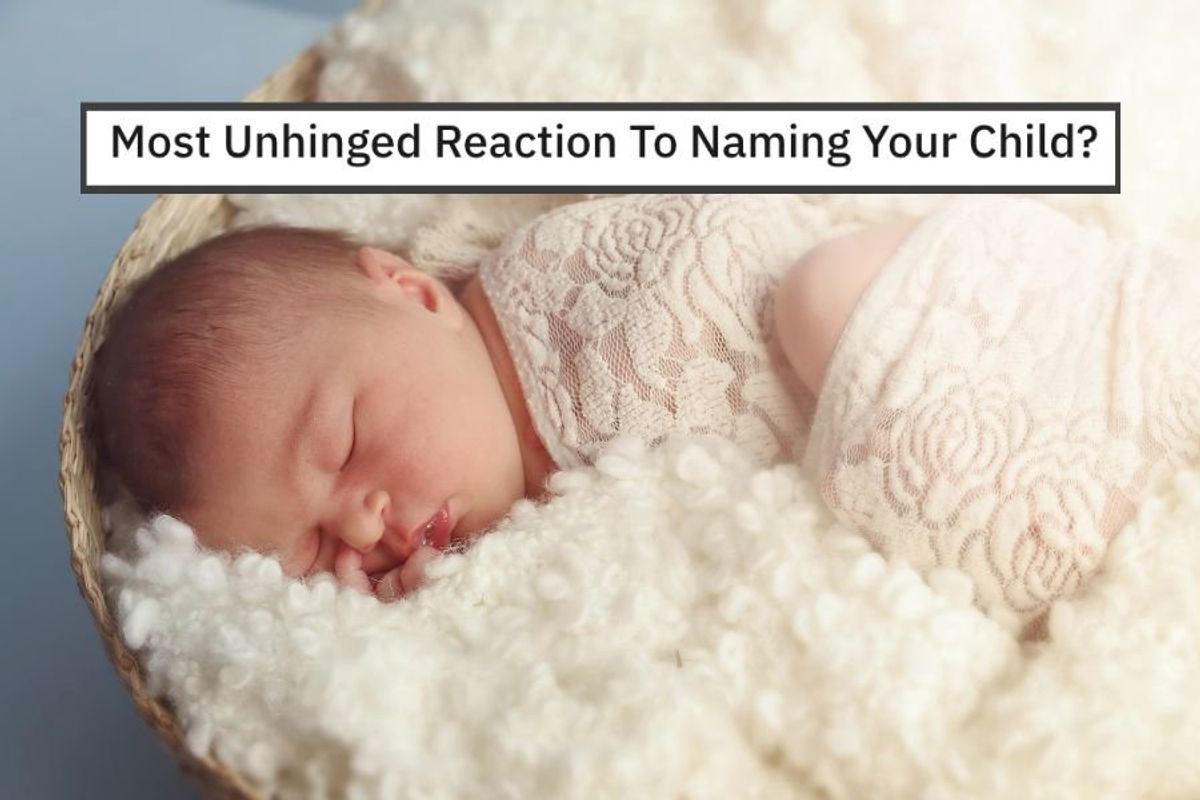a sleeping baby swaddled in white.