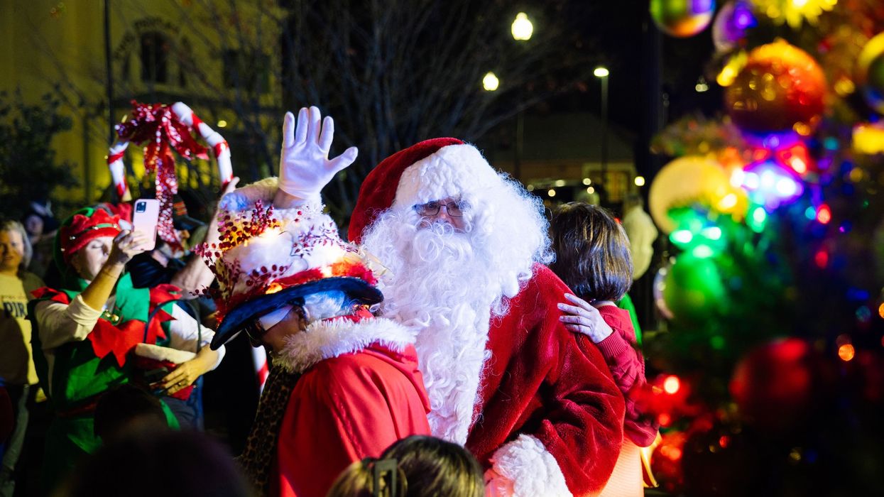 Santa waves to onlookers.