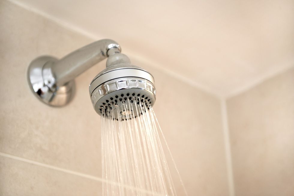 close-up-of-water-pouring-from-shower-head