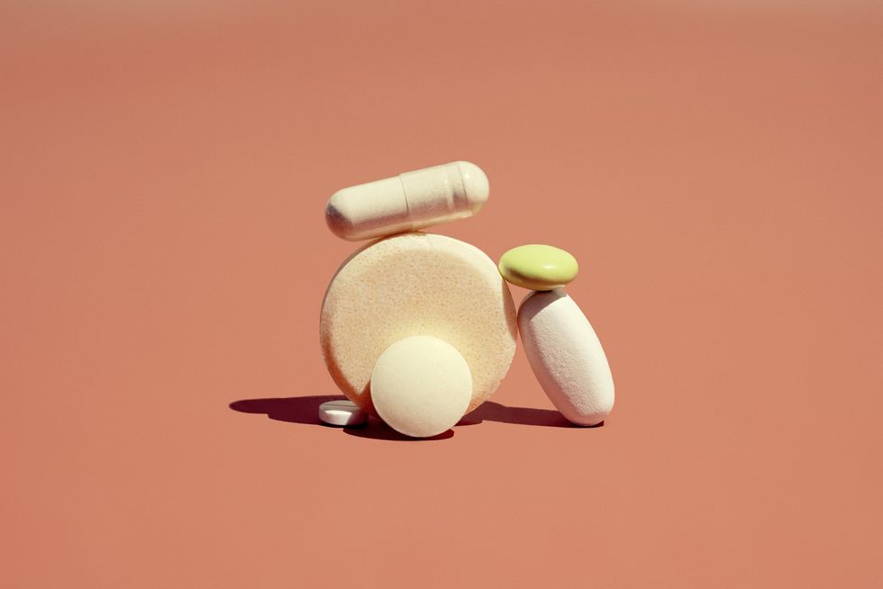 vitamins-supplements-against-orange-background