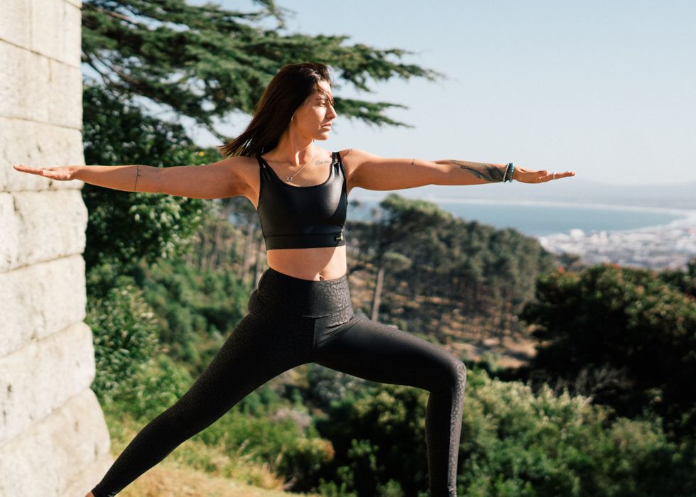 woman doing yoga pose outdoors