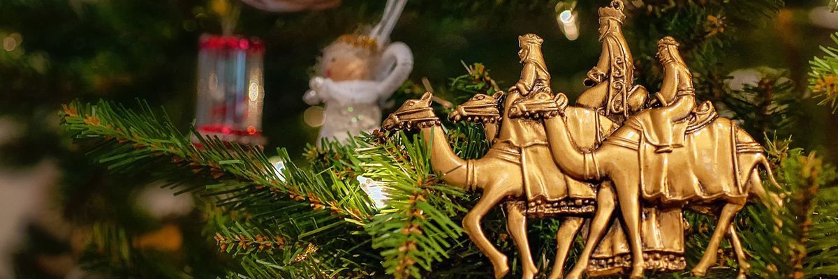 the three wise men ornament hanging from christmas tree
