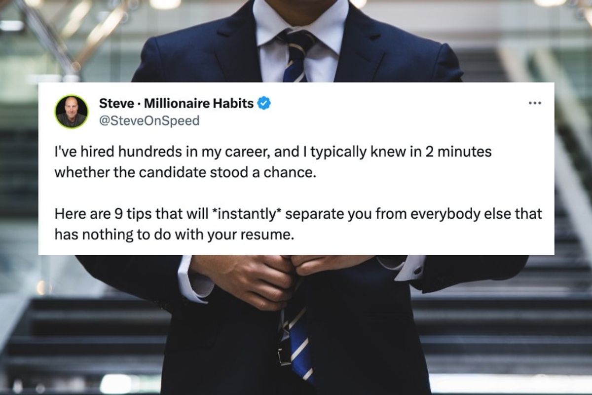 man in a suit in the background with a tweet screenshot in front of him