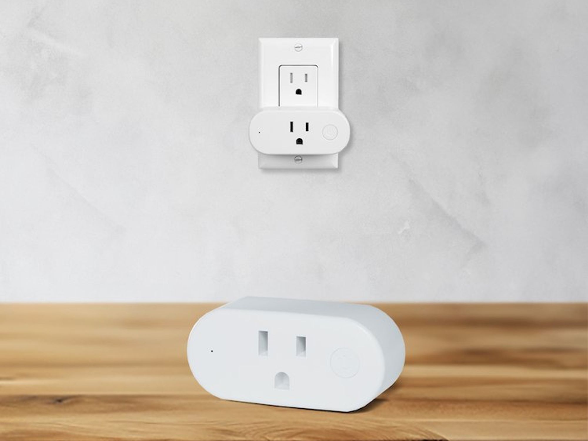 a photo of Shelly Qubino Wave Plug US on a desk and another plugged into an outlet