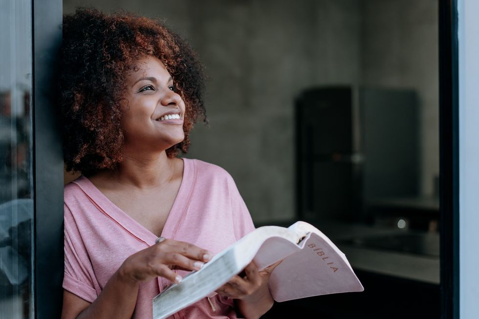 Black woman reading the Bible