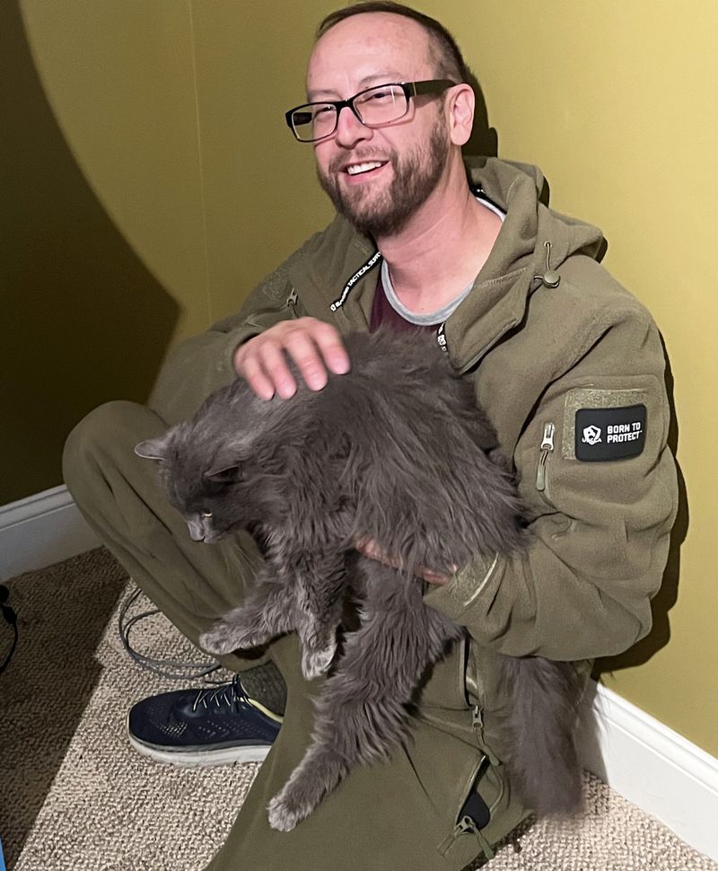 cat hugs man best friends