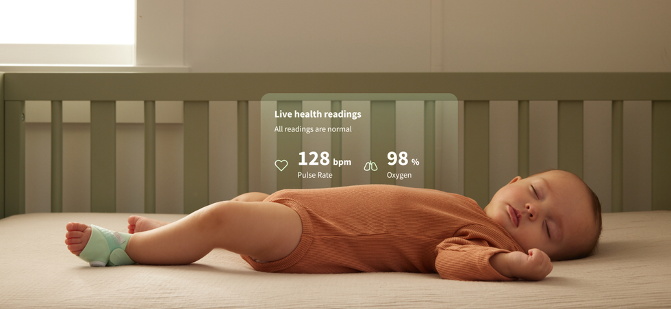 a photo of a baby sleeping with Owlet FDA Cleared Dream Sock and graphics showing