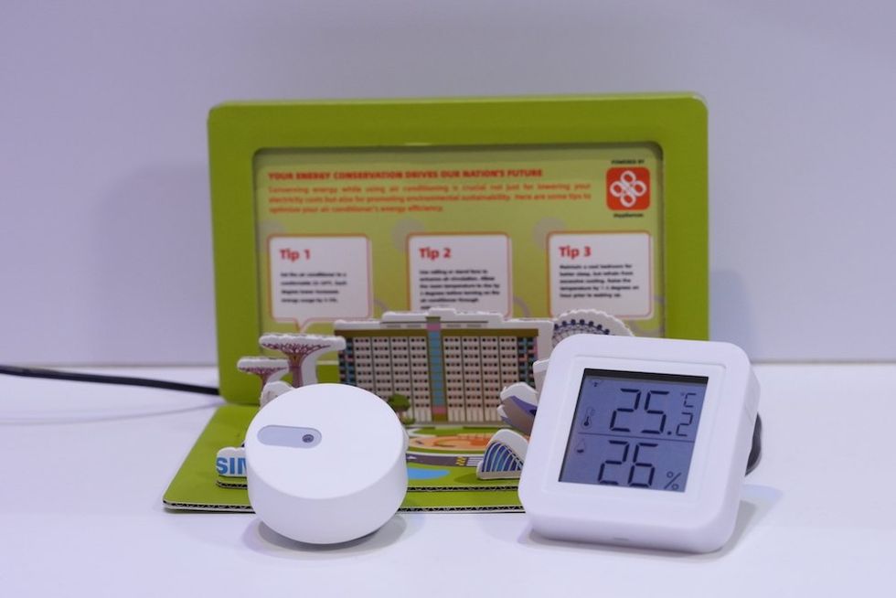 a photo of smart devices, like smart thermomstate, sensors that are powered by Tuya's platform. 