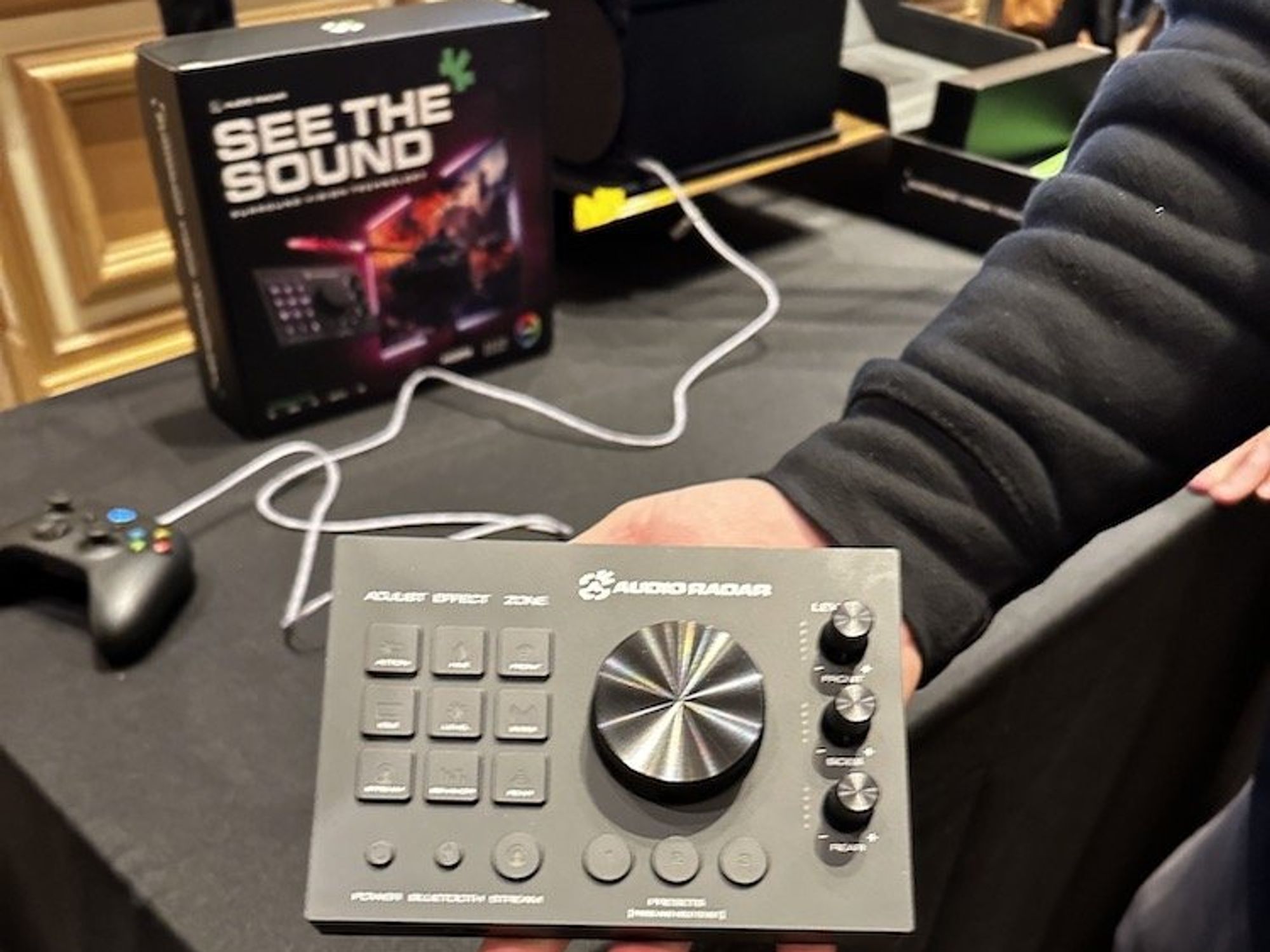 a person holding Audio Radar device at the CES Show 2024
