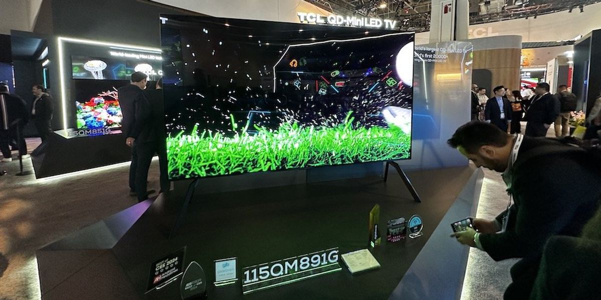 a photo of TCL 115" QD Mini LED smart TV on display in TCL booth at CES Show 2024