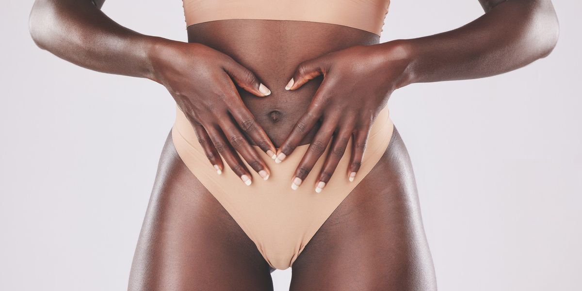 Close-up-of-woman-in-her-underwear-with-her-hands-in-front-of-her-womb-in-a-heart-shape