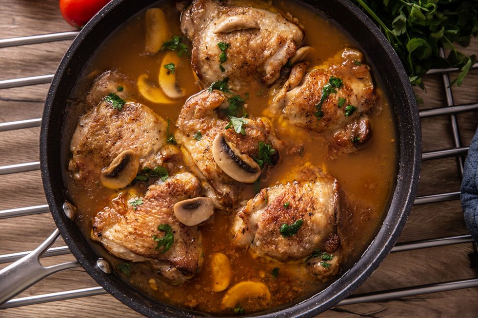 birds-eye-view-of-a-close-up-of-chicken-thighs-and-mushroom-stew-dish