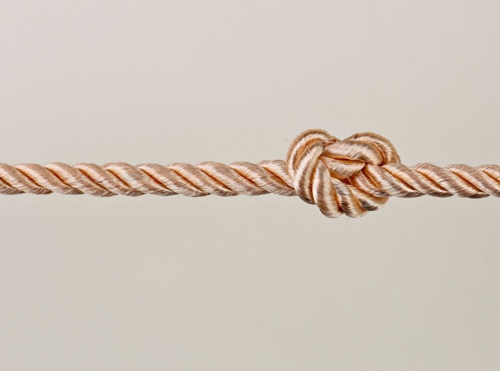 a-close-up-shot-of-a-knotted-rope