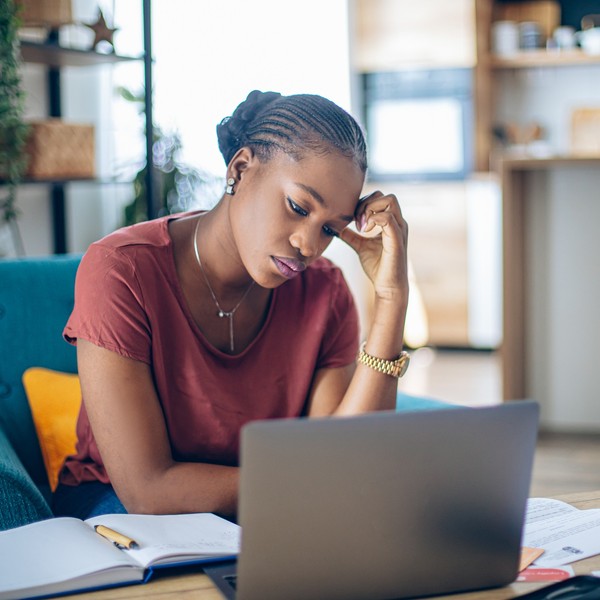 young-African-woman-taking-a-break-from-work-feeling-stressed