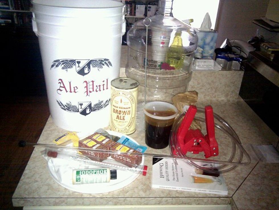 Counter full of supplies to make home-brew beer
