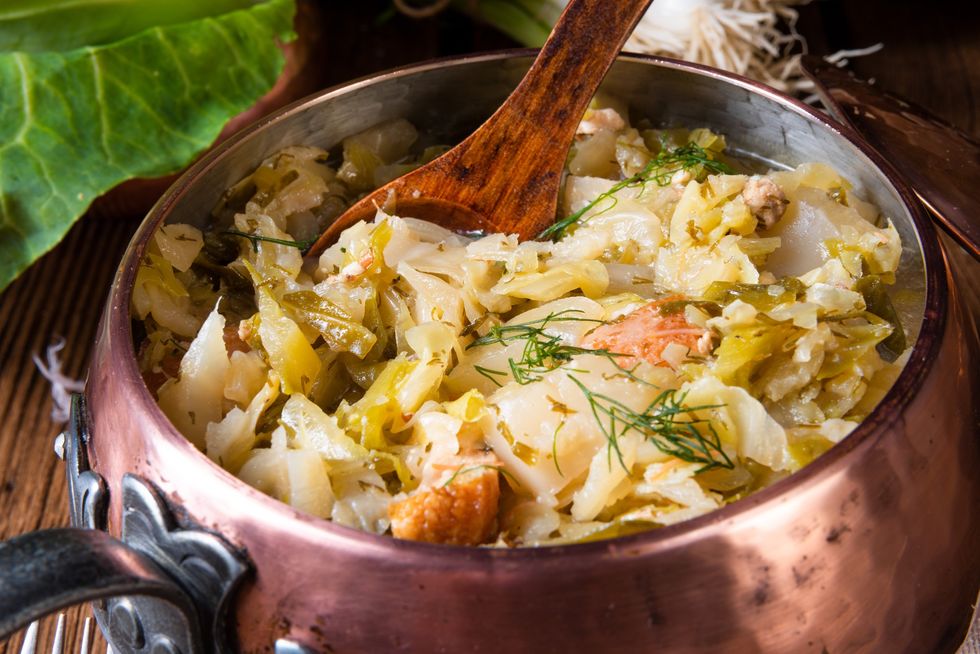 Cooked-cabbage-in-a-copper-pot-on-a-rustic-background