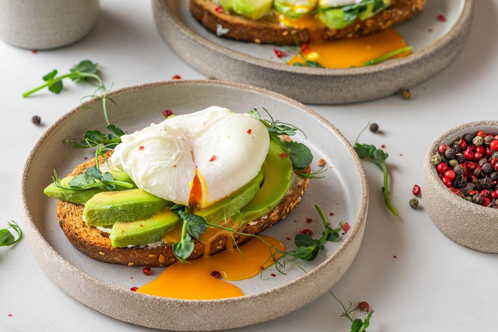 Avocado-toast-poached-egg-bean-sprouts-red-pepper-flakes