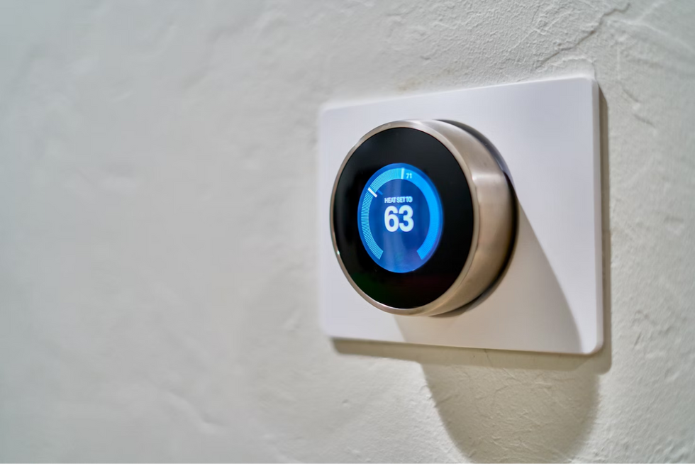 a photo of a Nest Smart Thermomstat installed.