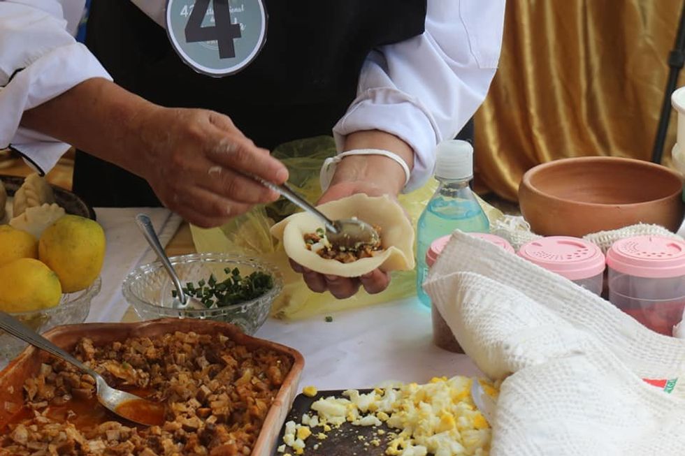 Preparation of an Argentine empanada at the national empanada festival, in 2021